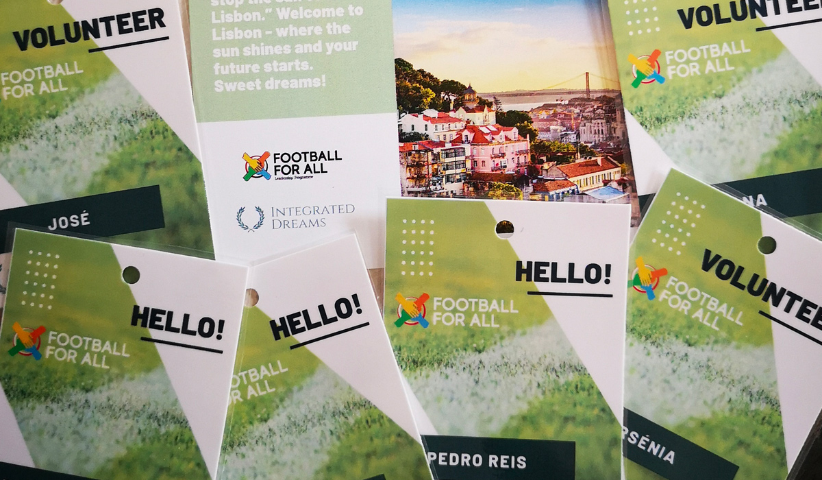 Football For All Leadership Programme 2019 badges with participant names, logos and a picture of Lisbon in the background