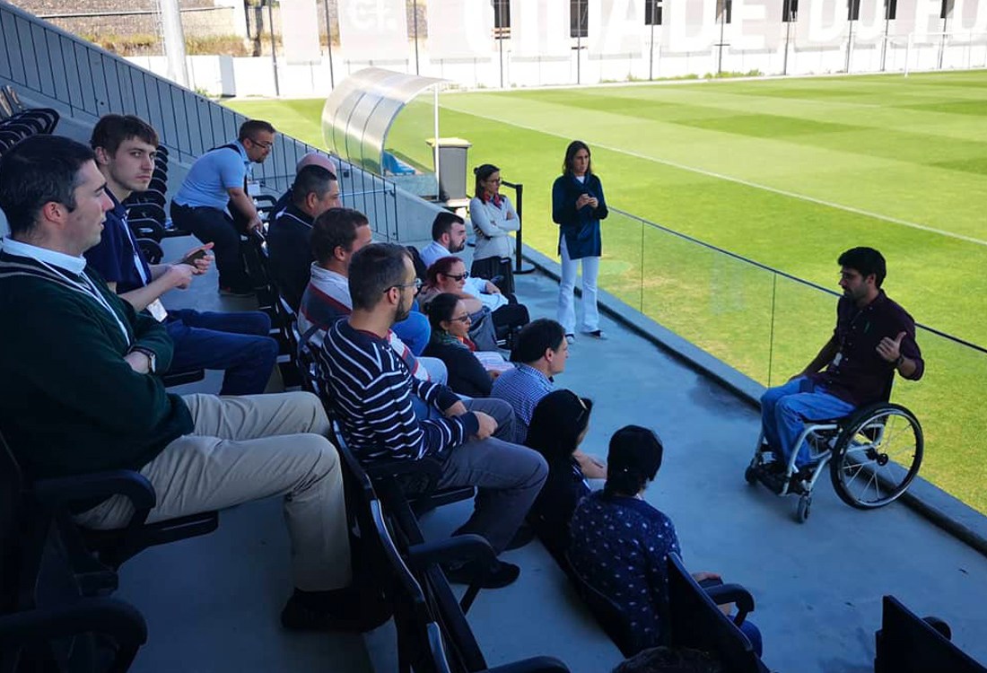 Football For All Leadership Programme class of 2019 visiting the Portuguese Football Association in the stands with guide 2018 Alumni Eduardo Maia