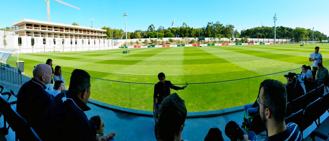 FFALP class of 2019 visiting the Portuguese FA with 2018 Alumni Eduardo Maia as guide and football pitch in the background