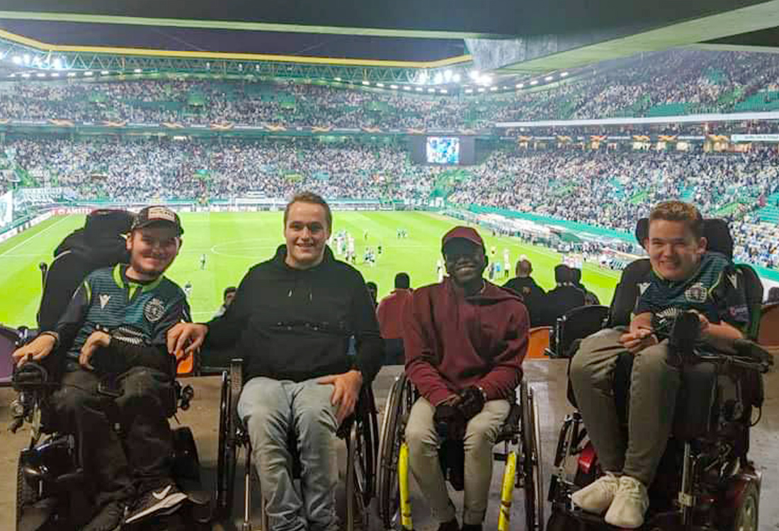 Football For All Leadership Programme wheelchair participants at Sporting Lisbon stadium attending football match with stands in the background