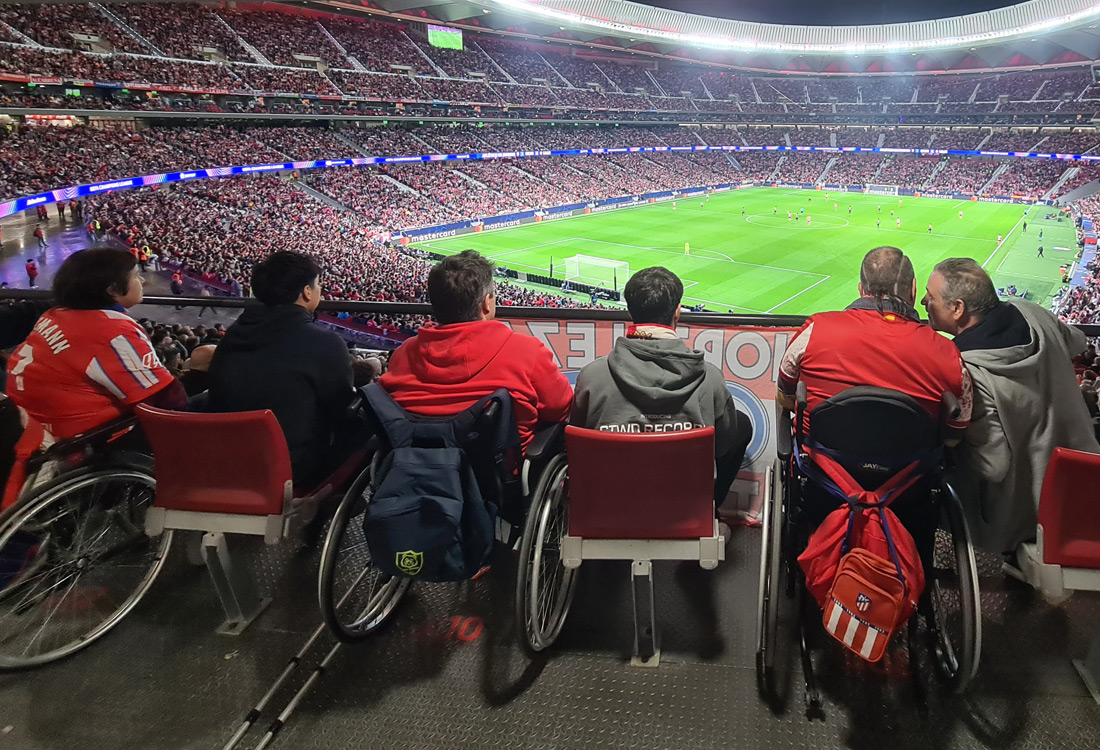 Football For All Leadership Programme wheelchair participants at Sporting Lisbon stadium attending football match with stands in the background