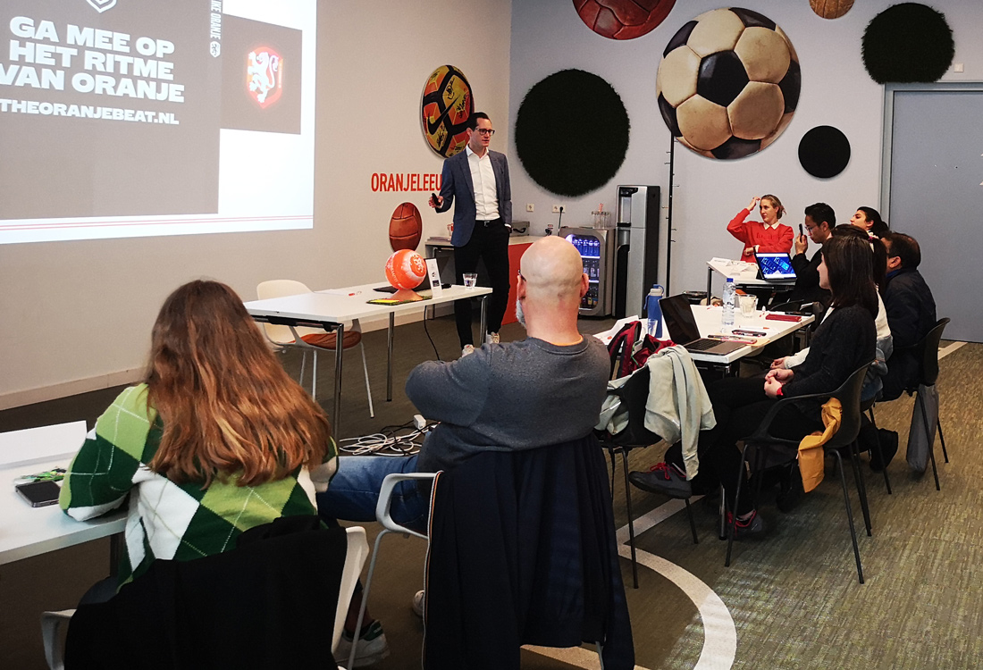 Football For All Leadership Programme graduation ceremony group listening to guest speaker Professor Paul Kitchin at the AVIVA Stadium in Dublin 